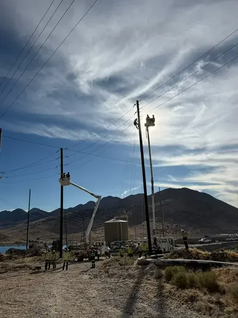 Utility poles and conductors against the sky