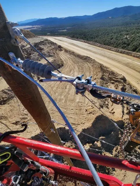Field equipment viewed from above a dirt road