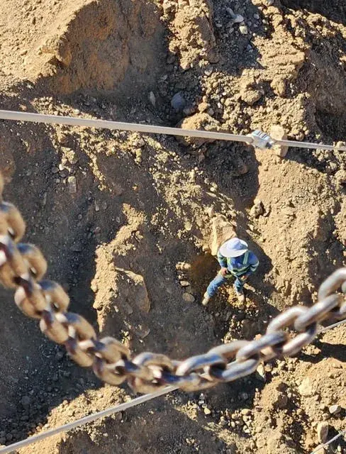 Chain and equipment on rocky ground