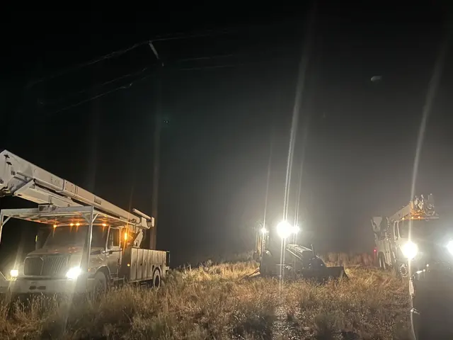 Field trucks supporting overhead line work at night